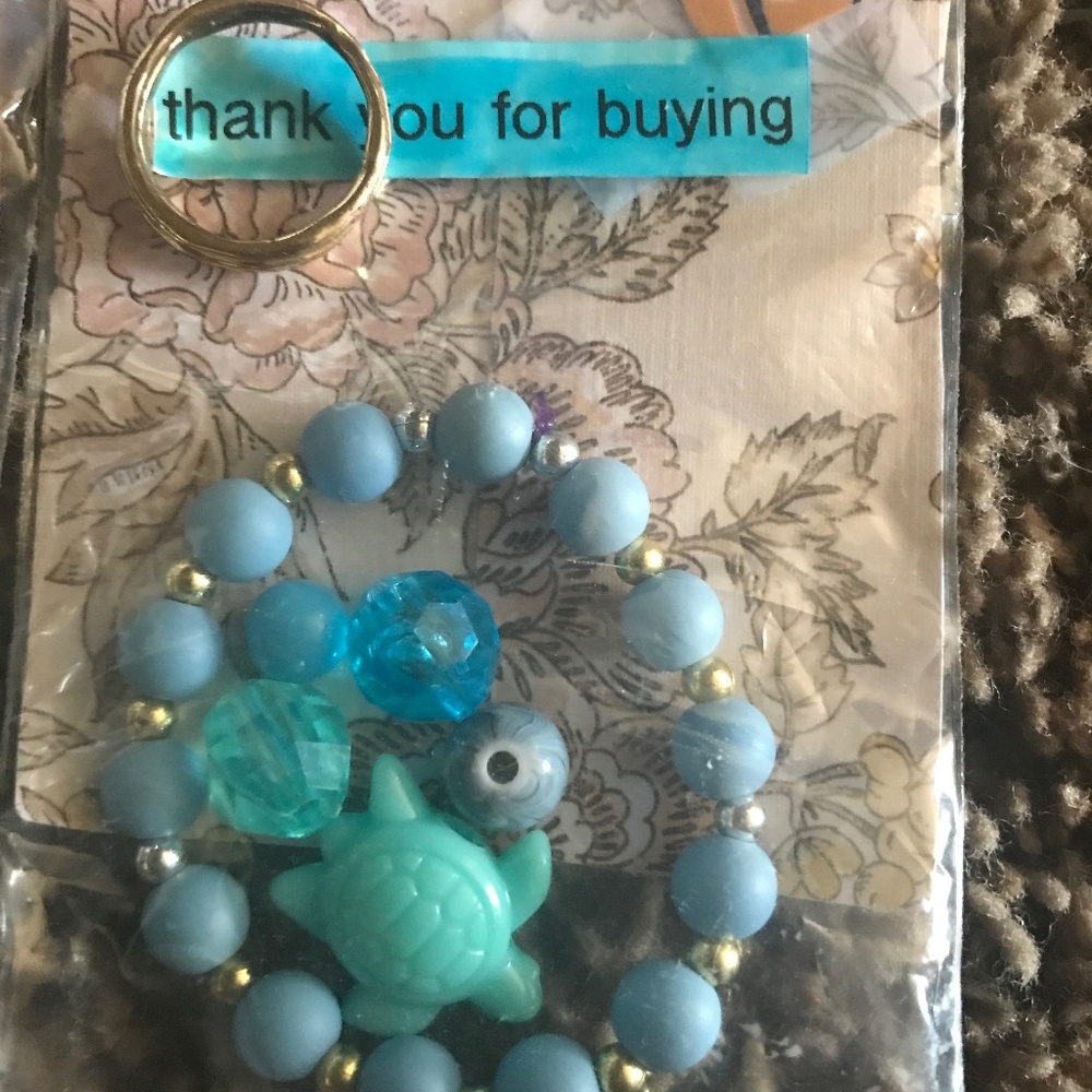 Bracelet with 5 charms and a ring